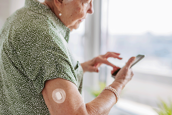 GlucoSensor CGM on arm with App